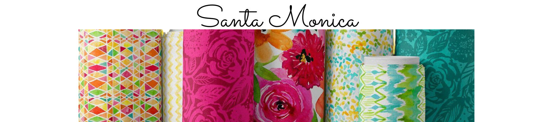Rolls of fabric in bright spring colors of pink, turquoise and yellow.  Santa Monica fabric collection.