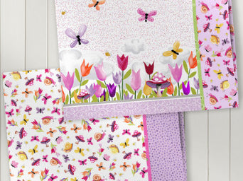 Cute tulips, mushrooms, butterflies and Sloane the Snail on white fabric.  Sloane the Snail Collection Clothworks