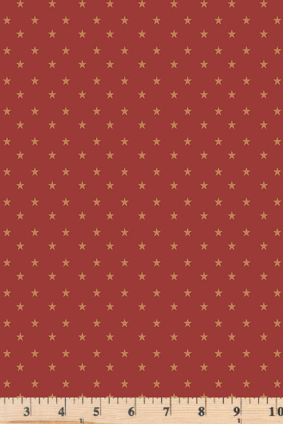 Tiny gold stars on red cotton fabric.  Coming Home Stars REd Barn