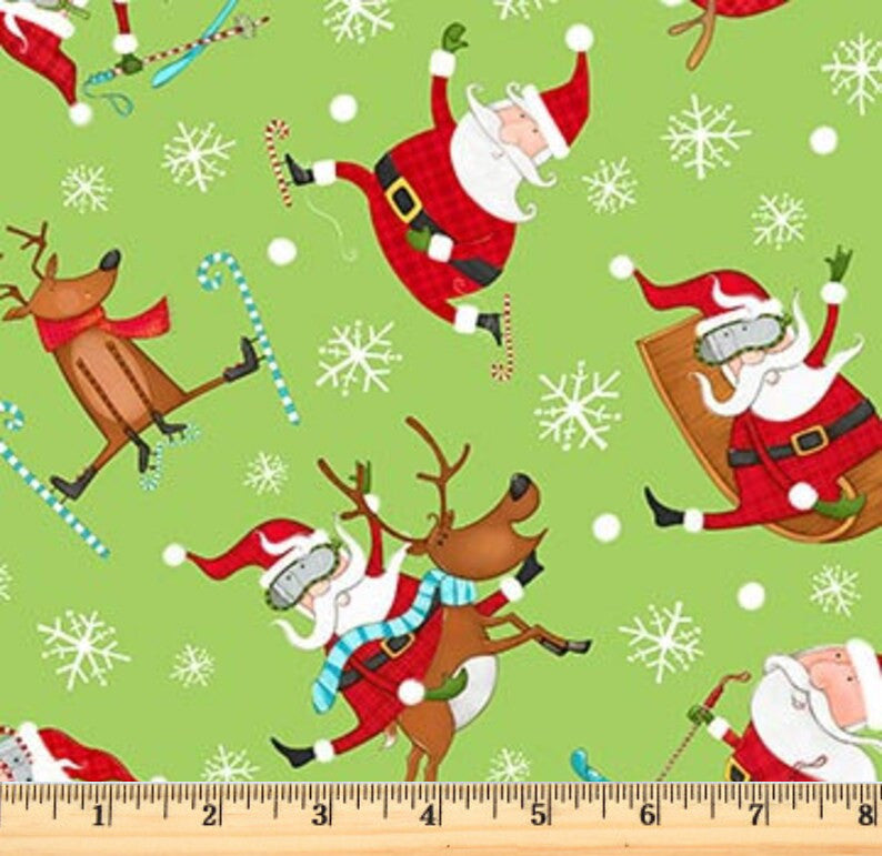 Whimsical patterns of Santa with his reindeer on skis, sleds and snow shoes in various poses on green fabric. Extreme Santa Green close up view.