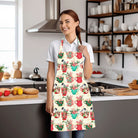 Woman in kitchen wearing apron Peppermint Christmas with cups, birds and fruit.