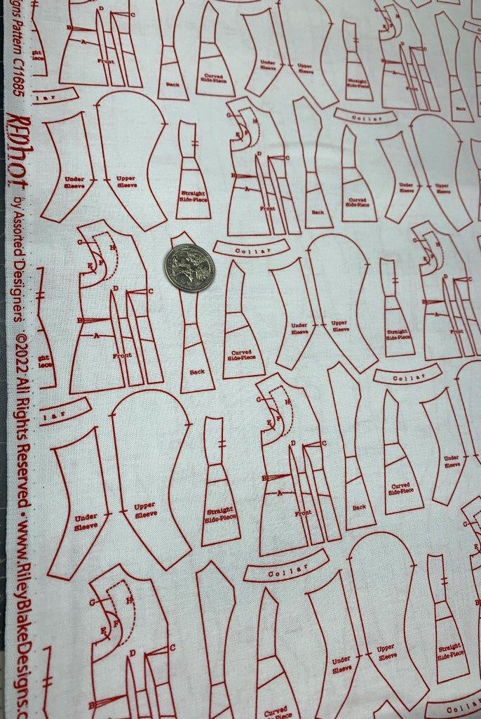 Sewing pattern pieces outlined in red on white fabric.  Red Hot Patterns White