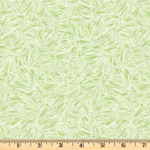 Packed geo butterflies in light green and white on 100% cotton fabric. Alluring Butterflies Stained Wings Light Green.