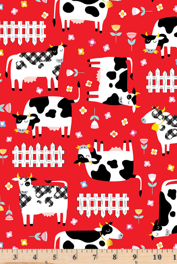 Black and white cows and white picket fences tossed on red 100% cotton fabric.  Barnyard Rules Moo Crew Red.