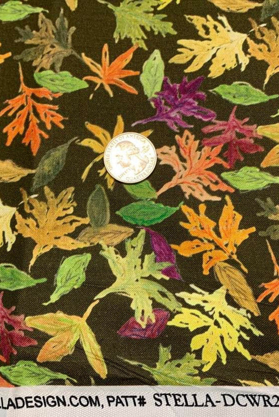 Leaves in orange, gold and green tossed on brown cotton fabric.  Pumpkin Spice Falling Leaves
