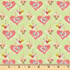 Coral hearts on light green 100% cotton fabric.  Be the Light Hearts light green